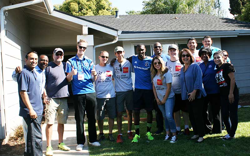 Group in front of home