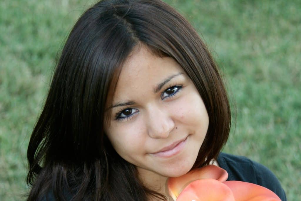 Young woman holding flower