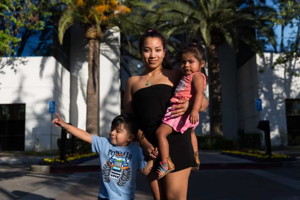 Karla poses for a portrait with her children